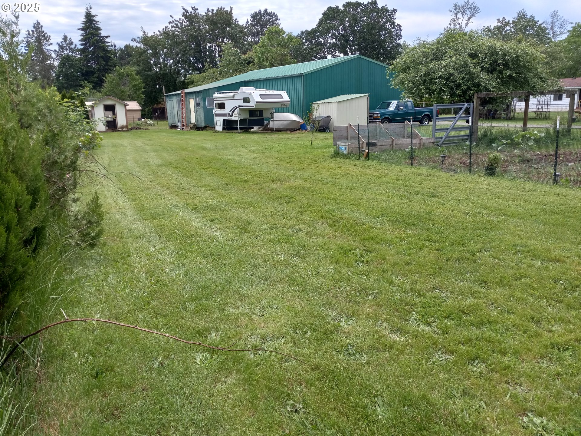 32604 South Krupicka Way Molalla, OR 97038 - Photo 11 of 18 a front view of a house with garden