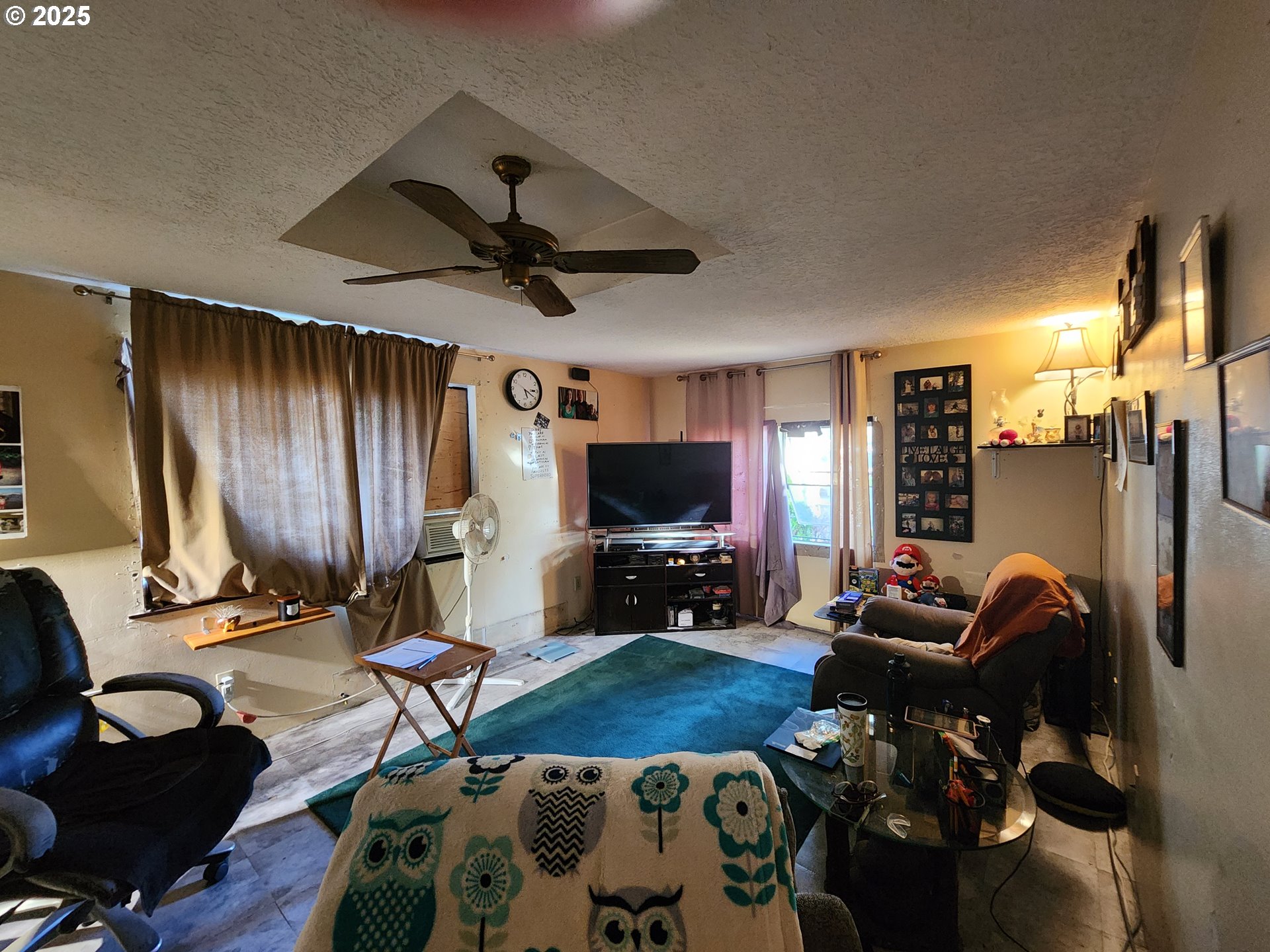 32604 South Krupicka Way Molalla, OR 97038 - Photo 6 of 18 a living room with furniture a flat screen tv and a large window