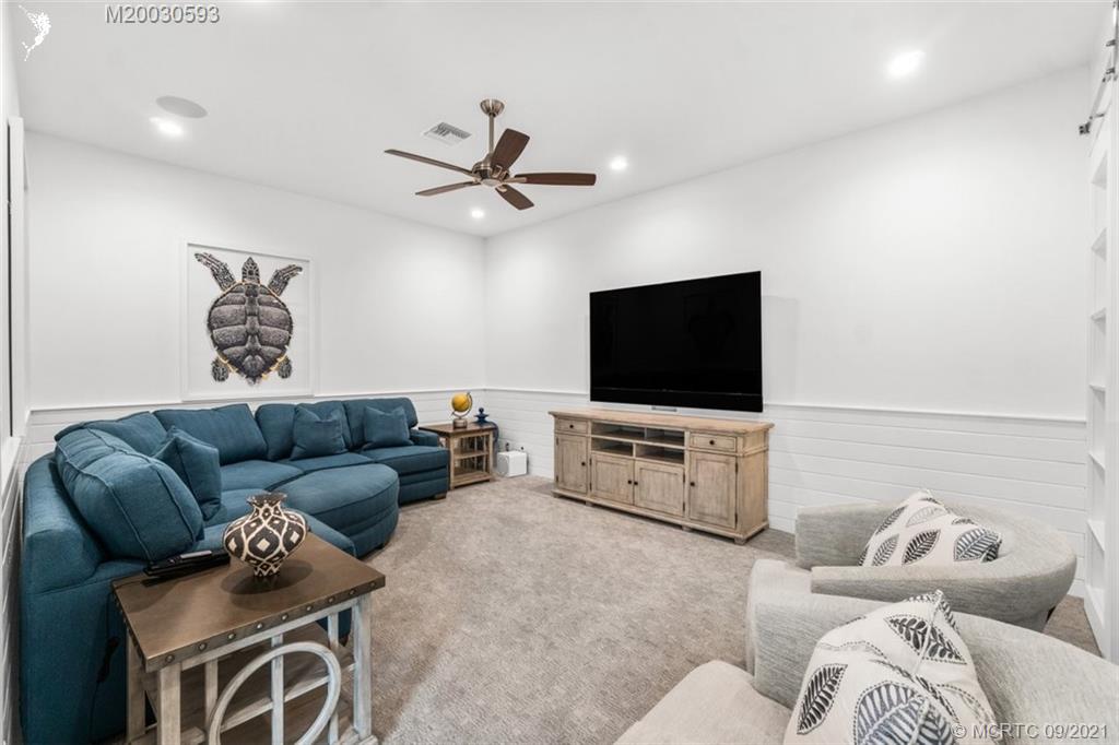 1904 Southeast Sailfish Point Boulevard Stuart, FL 34996 - Photo 15 of 72 a living room with furniture and a flat screen tv