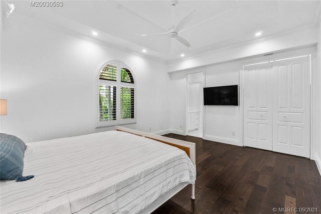 1904 Southeast Sailfish Point Boulevard Stuart, FL 34996 - Photo 20 of 72 a bedroom with a bed and a window