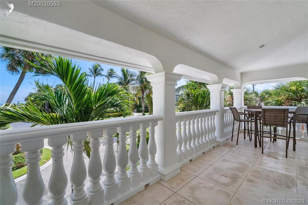 1904 Southeast Sailfish Point Boulevard Stuart, FL 34996 - Photo 39 of 72 a view of a porch with furniture