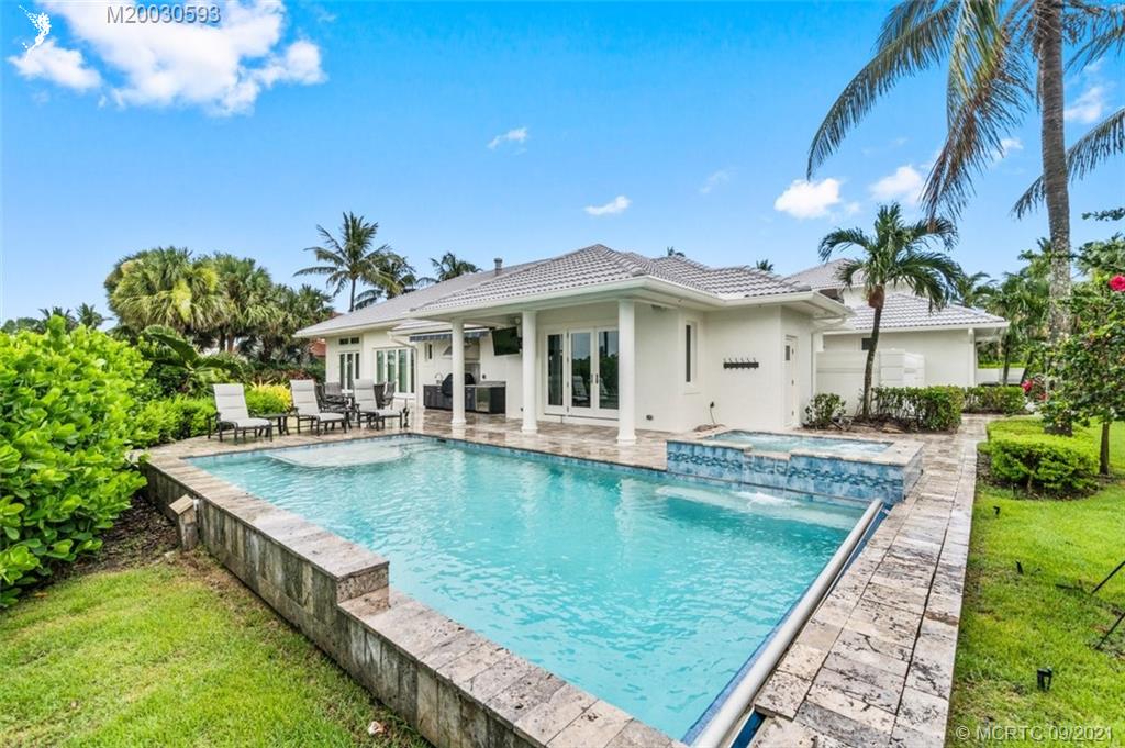 1904 Southeast Sailfish Point Boulevard Stuart, FL 34996 - Photo 47 of 72 a view of a house with swimming pool