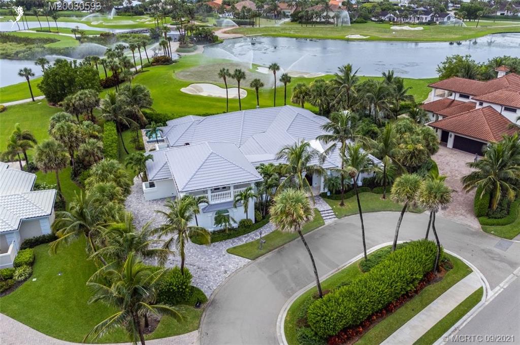 1904 Southeast Sailfish Point Boulevard Stuart, FL 34996 - Photo 58 of 72 an aerial view of a house with a garden and lake view