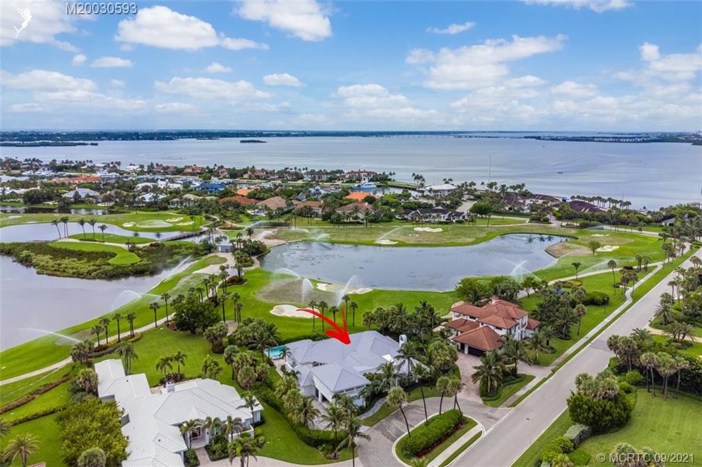 1904 Southeast Sailfish Point Boulevard Stuart, FL 34996 - Photo 67 of 72 an aerial view of residential houses with outdoor space