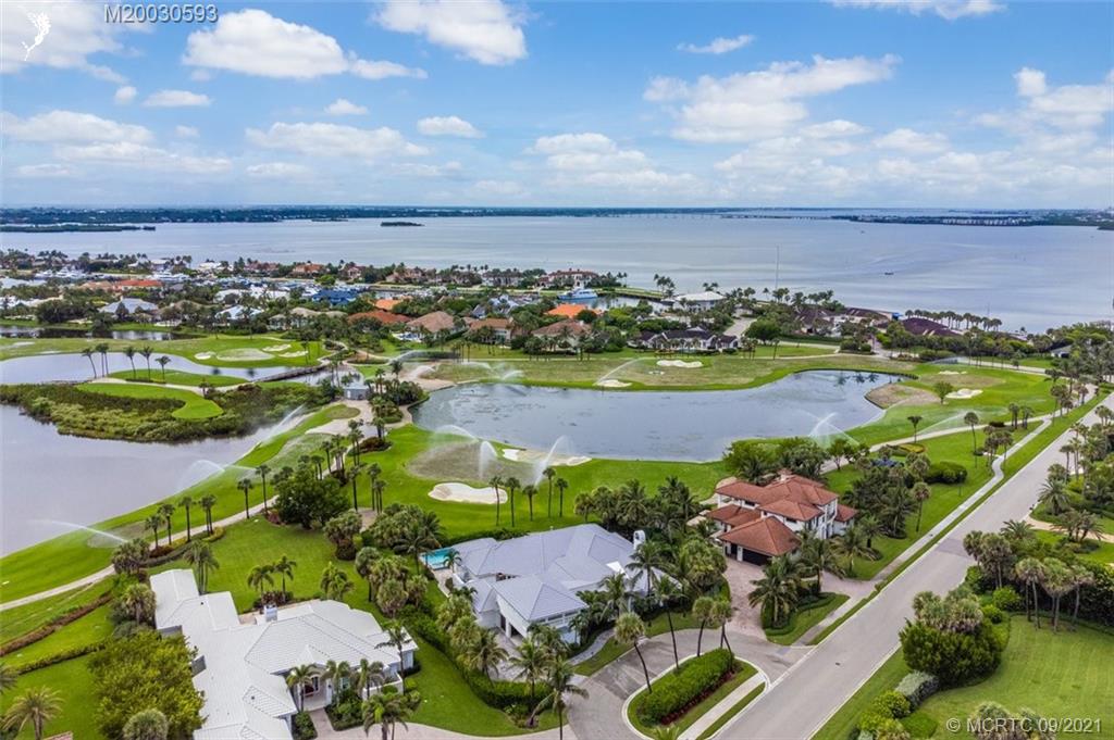 1904 Southeast Sailfish Point Boulevard Stuart, FL 34996 - Photo 68 of 72 an aerial view of residential houses with outdoor space