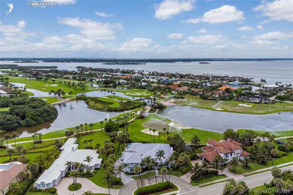 1904 Southeast Sailfish Point Boulevard Stuart, FL 34996 - Photo 70 of 72 an aerial view of residential houses with outdoor space