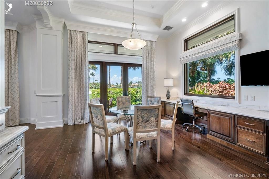 1904 Southeast Sailfish Point Boulevard Stuart, FL 34996 - Photo 10 of 72 a view of a dining room with furniture window and wooden floor
