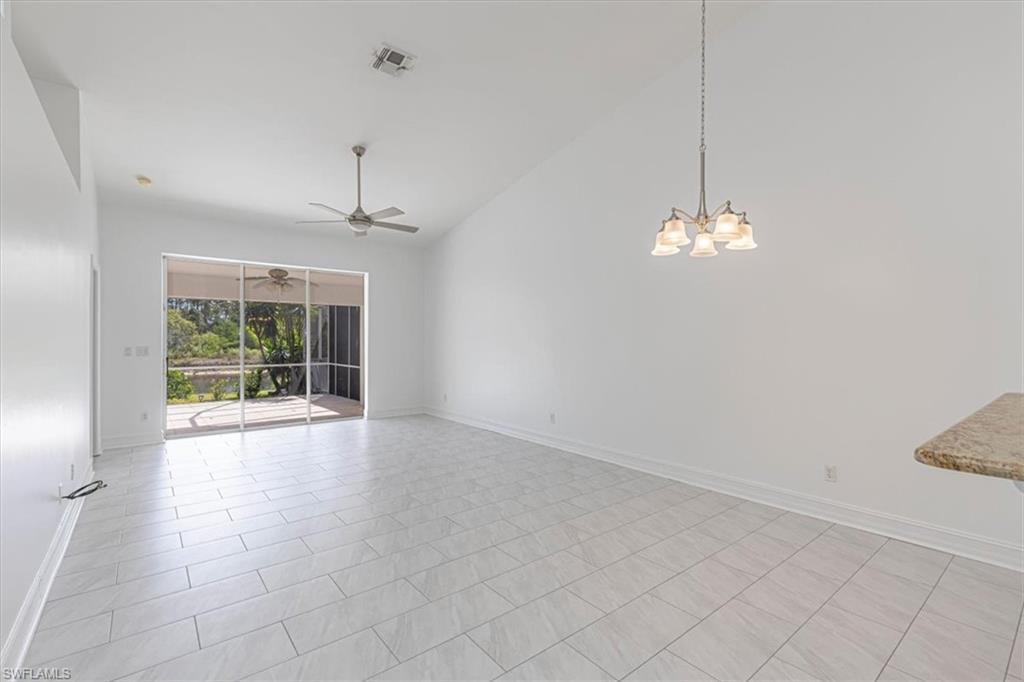 5446 Whitten Drive, Unit 19 Naples, FL 34104 - Photo 16 of 24 a view of livingroom with chandelier