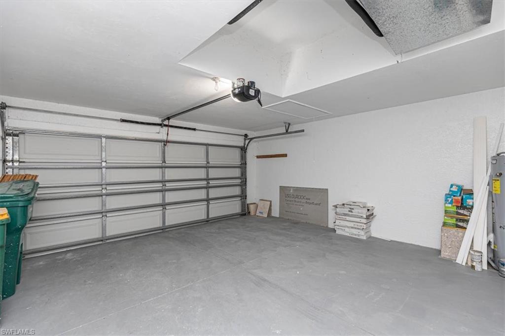 5446 Whitten Drive, Unit 19 Naples, FL 34104 - Photo 22 of 24 a view of a garage