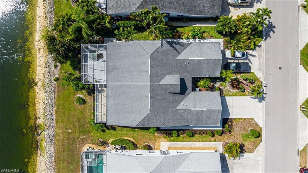 5446 Whitten Drive, Unit 19 Naples, FL 34104 - Photo 3 of 24 an aerial view of residential house with yard and swimming pool