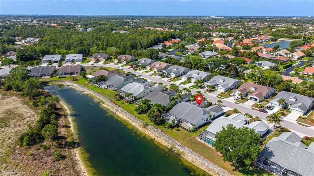 5446 Whitten Drive, Unit 19 Naples, FL 34104 - Photo 5 of 24 an aerial view of residential houses with outdoor space