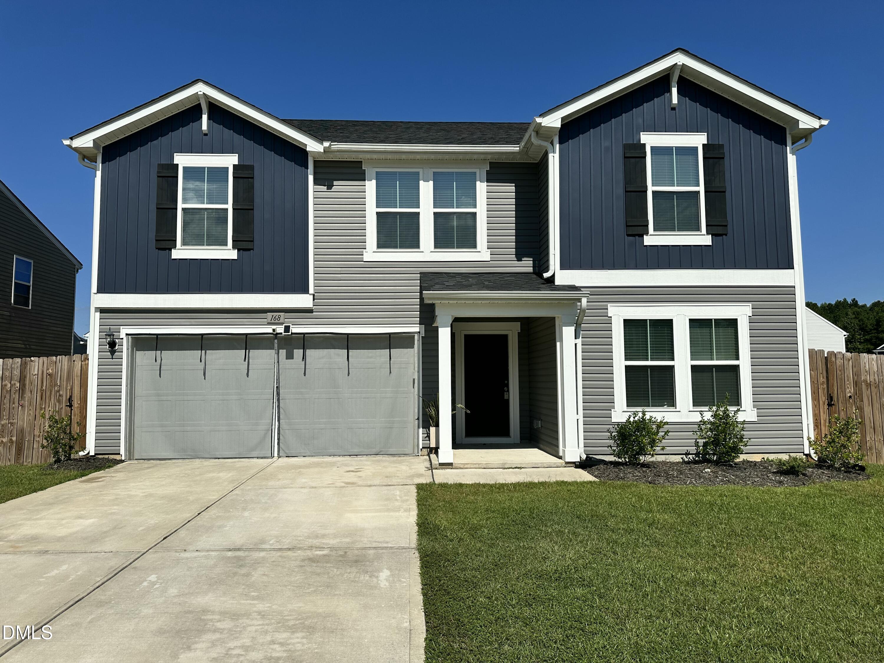 a front view of a house with yard