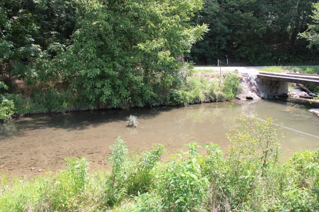 a backyard of a house with green space and outdoor seating