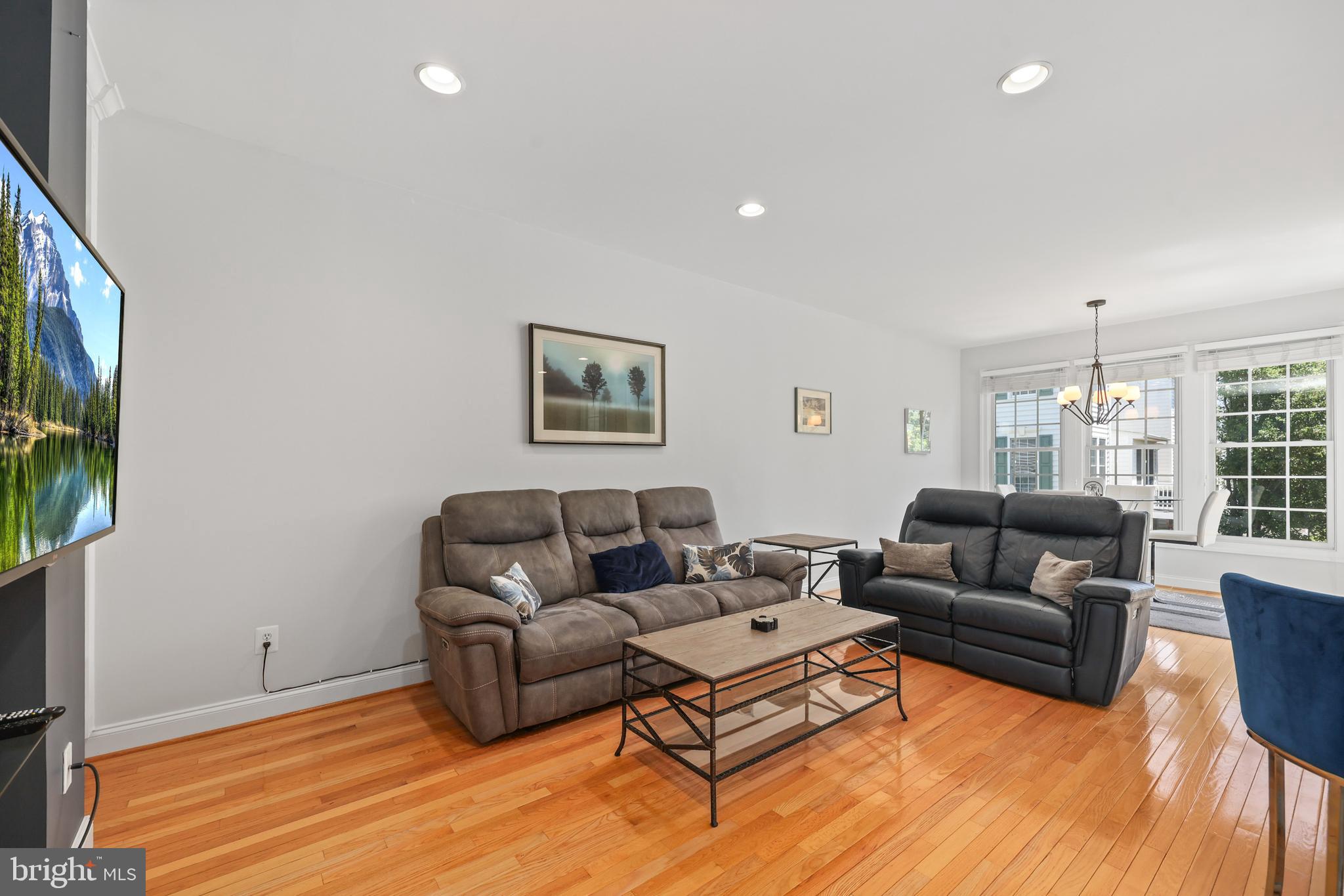 6806 Witton Circle Gainesville, VA 20155 - Photo 11 of 47 a living room with furniture and a flat screen tv