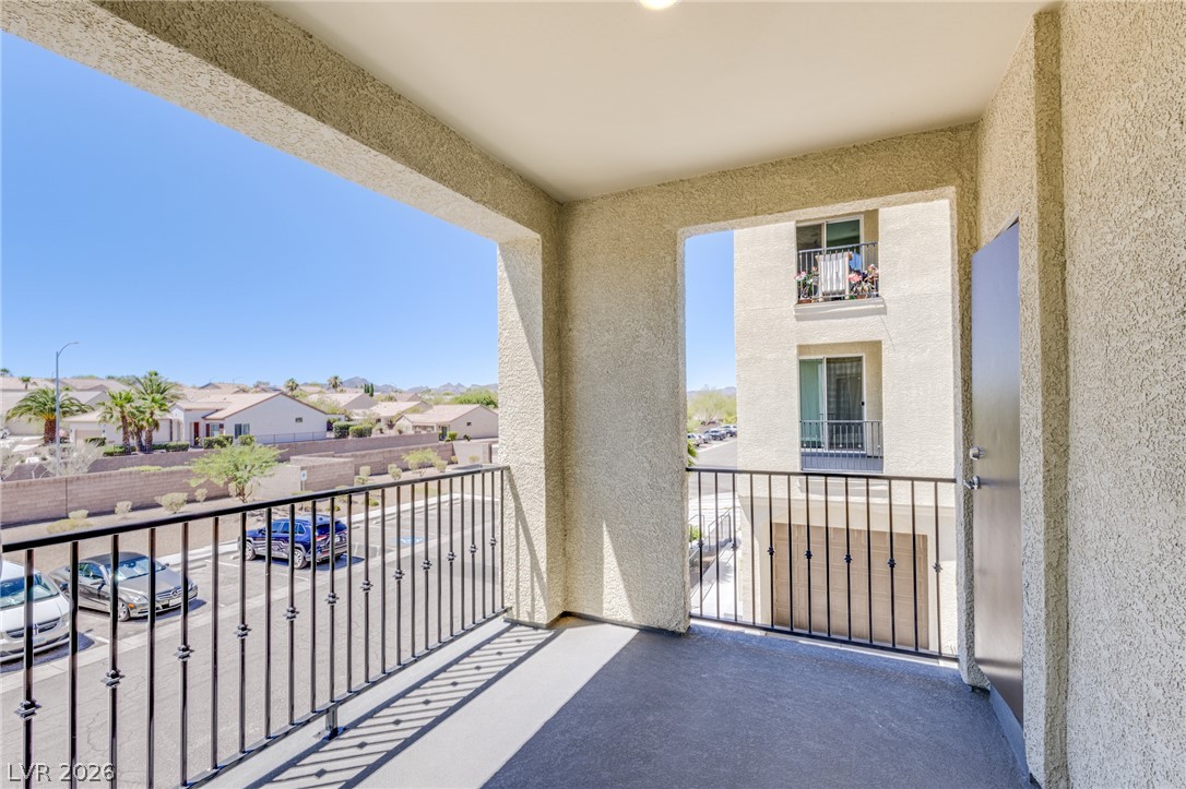 2555 Hampton Road, Unit 8206 Henderson, NV 89052 - Photo 4 of 25 An inviting balcony space offers sweeping views of the neighborhood and beyond.