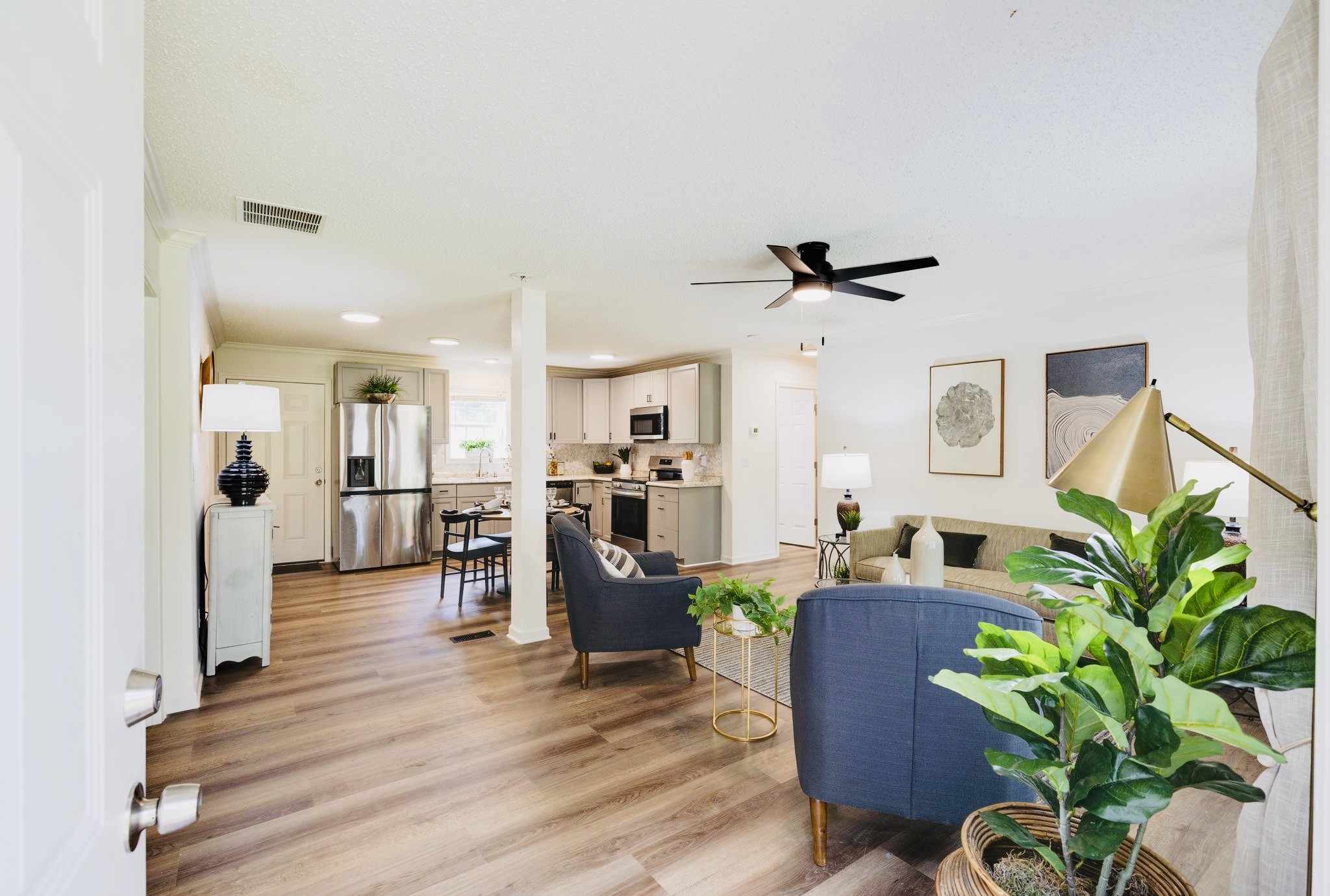 3921 Johnson Hollow Road Thompson's Station, TN 37179 - Photo 2 of 38 a living room with furniture and a potted plant