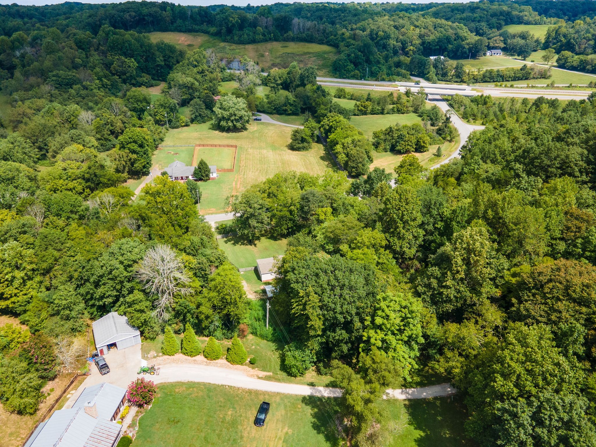 3921 Johnson Hollow Road Thompson's Station, TN 37179 - Photo 26 of 38 an aerial view of a house with a yard