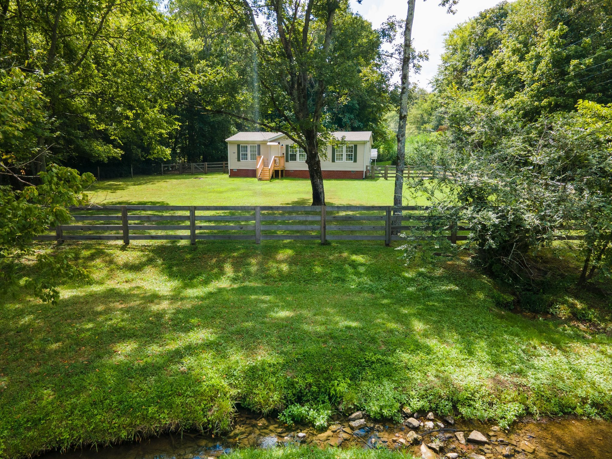 3921 Johnson Hollow Road Thompson's Station, TN 37179 - Photo 27 of 38 a view of a house with a yard and sitting area