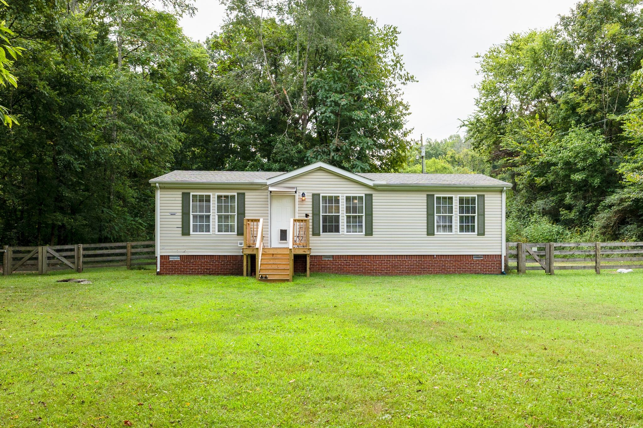 3921 Johnson Hollow Road Thompson's Station, TN 37179 - Photo 33 of 38 a view of a house with a yard and deck