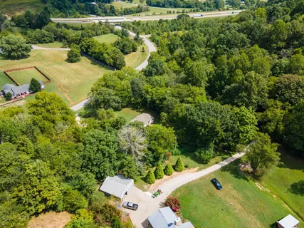 an aerial view of a house with a yard