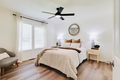 a bedroom with a bed and window