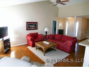 93 Morning Mist Road Fletcher, NC 28732 - Photo 7 of 12 a living room with furniture and a flat screen tv