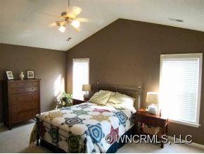 93 Morning Mist Road Fletcher, NC 28732 - Photo 8 of 12 a bedroom with a bed and a closet