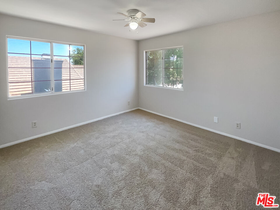 1615 East Kettering Street Lancaster, CA 93535 - Photo 12 of 15 an empty room with a window