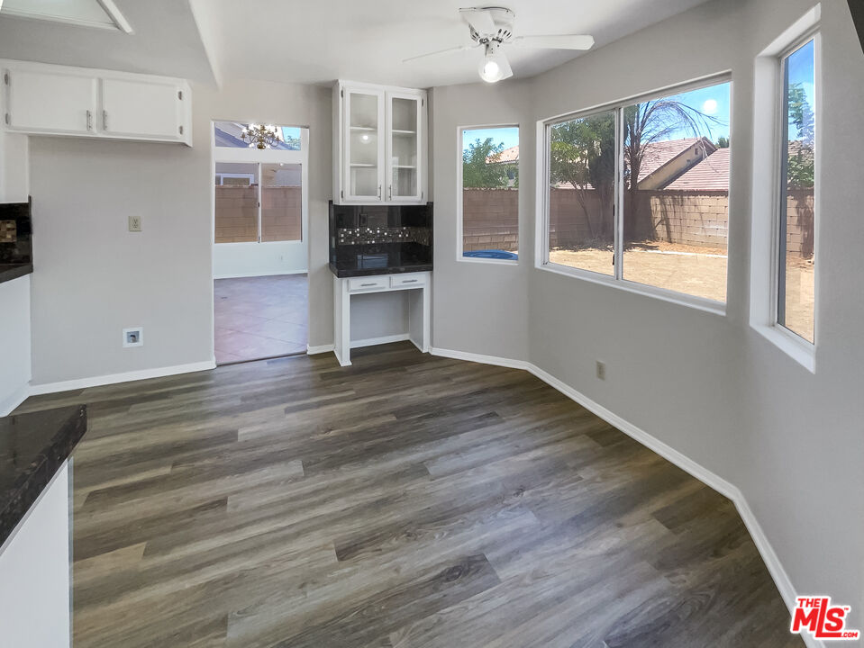 1615 East Kettering Street Lancaster, CA 93535 - Photo 8 of 15 a room with wooden floor and window