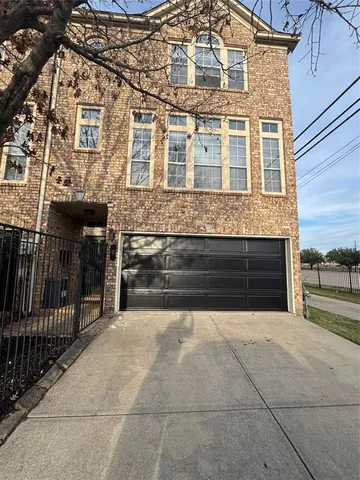 a front view of a house with a garage