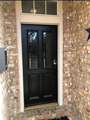a view of living room with furniture and wooden floor