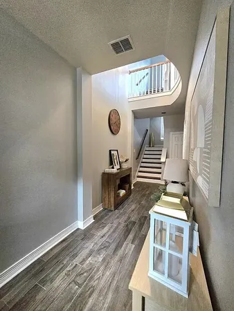 a bedroom with bed and wooden floor