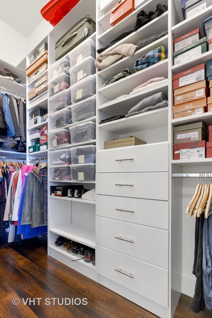 1132 West Adams Street, Unit PHE Chicago, IL 60607 - Photo 12 of 23 a view of walk in closet with clothes and shoes