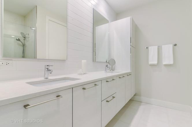 1132 West Adams Street, Unit PHE Chicago, IL 60607 - Photo 9 of 23 a bathroom with a double vanity sink and mirror