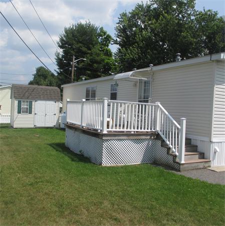32 Lower Windbrook Drive, Unit 32 Auburn, MA 01501 - Photo 3 of 13 a view of a house with a backyard and a deck