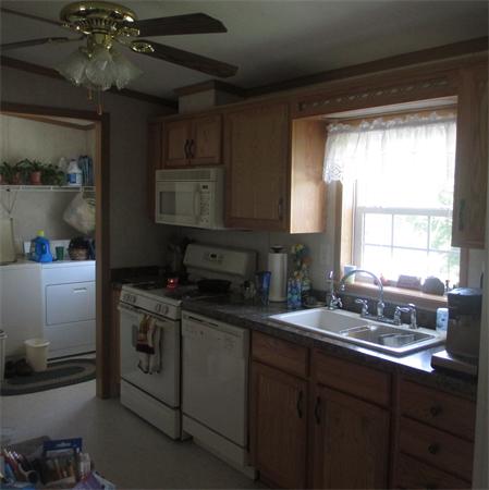 32 Lower Windbrook Drive, Unit 32 Auburn, MA 01501 - Photo 4 of 13 a kitchen with a sink stove and cabinets