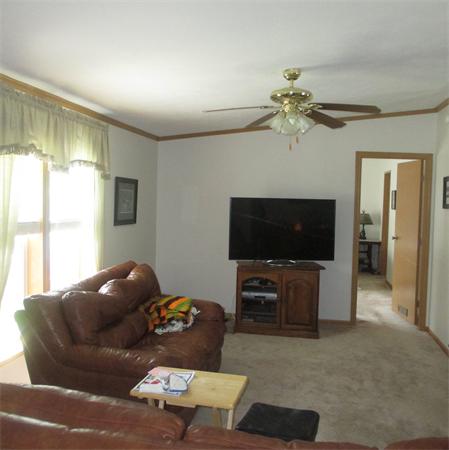 32 Lower Windbrook Drive, Unit 32 Auburn, MA 01501 - Photo 6 of 13 a living room with furniture and a flat screen tv
