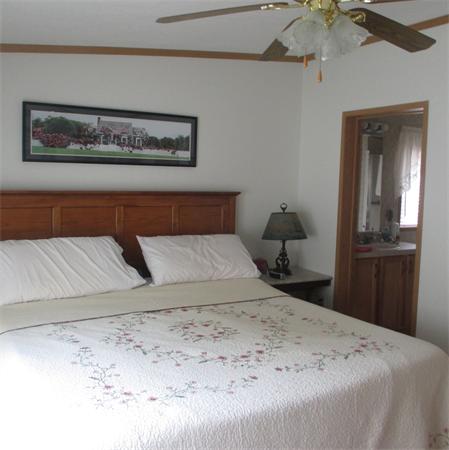 32 Lower Windbrook Drive, Unit 32 Auburn, MA 01501 - Photo 9 of 13 a bedroom with a bed and a painting on the wall