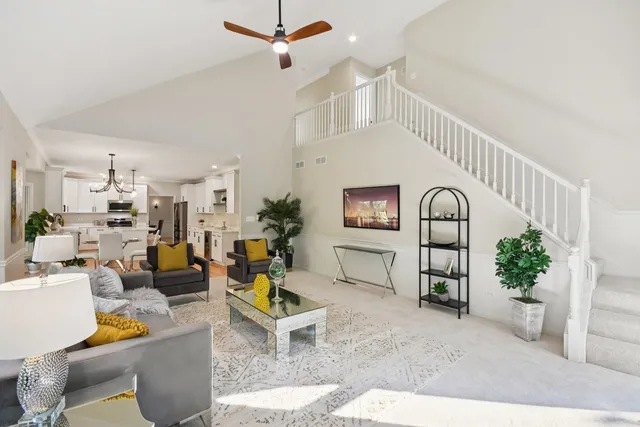 a living room with furniture and a potted plant