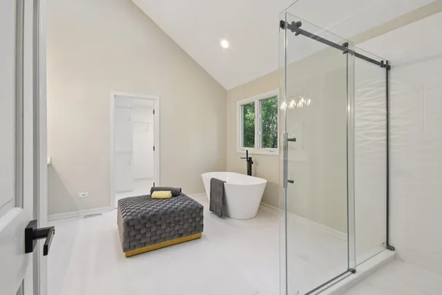 a bedroom with a bed and a bathroom