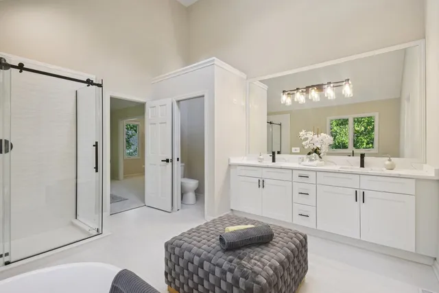 a bathroom with a bathtub and shower