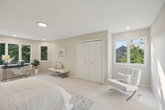 a bedroom with bed and a window