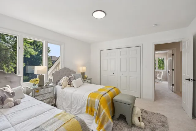 a bathroom with a granite countertop sink a mirror and a shower