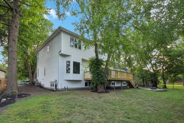 a view of a house with a yard porch and sitting area