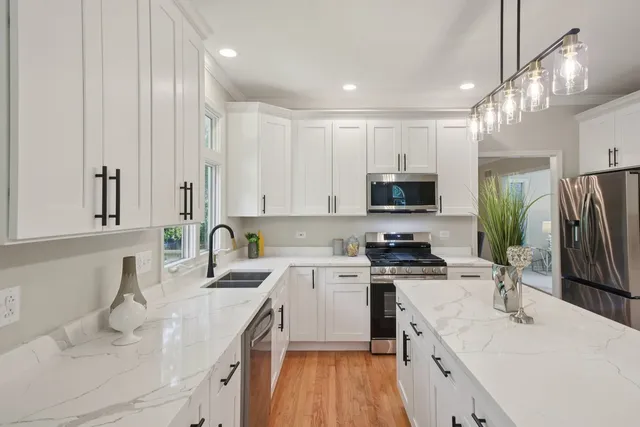 a kitchen with a sink stove and refrigerator