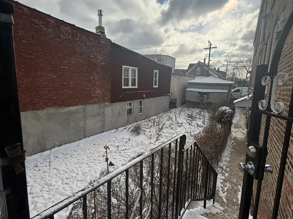 a view of balcony with furniture