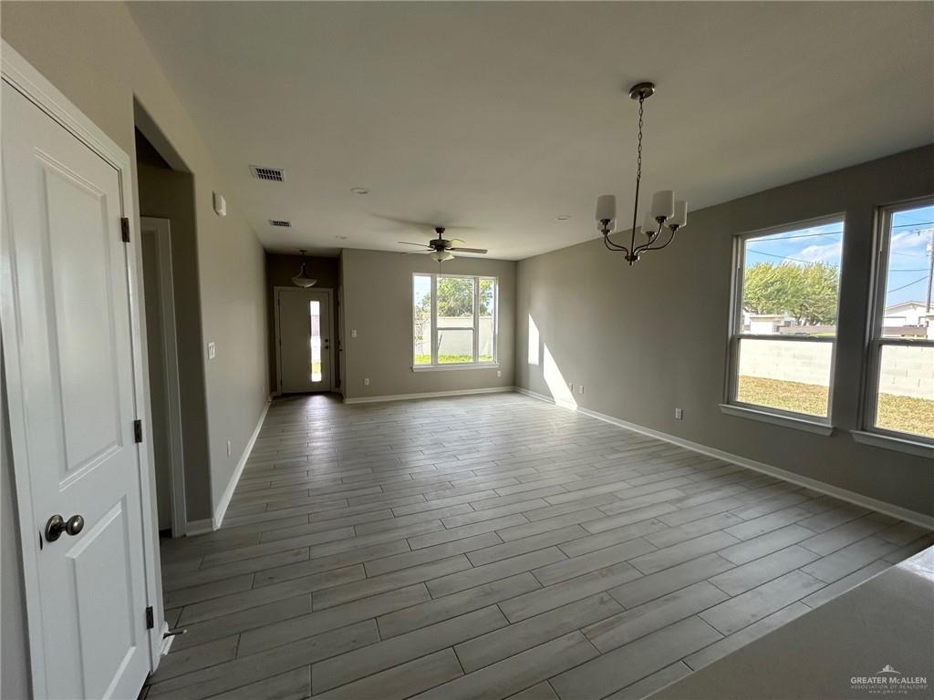 3524 Emory Avenue McAllen, TX 78504 - Photo 6 of 11 a view of a room with window wooden floor and chandelier