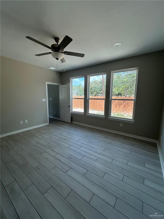 3524 Emory Avenue McAllen, TX 78504 - Photo 9 of 11 a view of an empty room with wooden floor and a window
