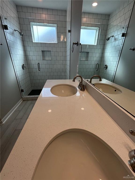 3524 Emory Avenue McAllen, TX 78504 - Photo 10 of 11 a bathroom with a sink a toilet and a mirror