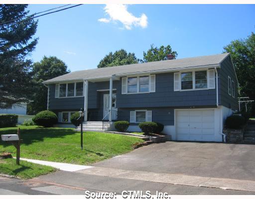 Exterior Front. Welcome Home! This well maintained 50 foot raised ranch has lots of windows for natural light. Note the pillars that flank the wide front entry. The roof is approximately 8 years old and the exterior was painted three years ago.